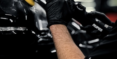 a man working on a car in a garage