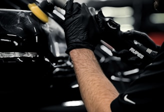 a man working on a car in a garage
